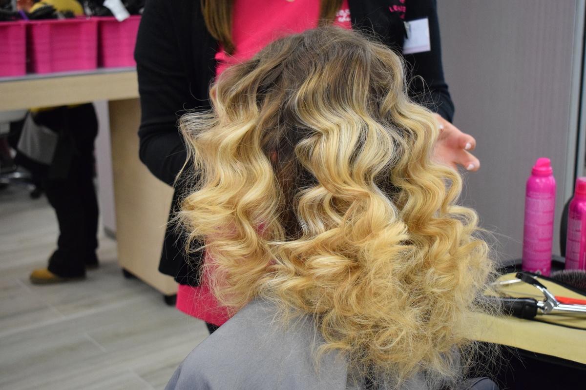 hair student styling blonde curly hair