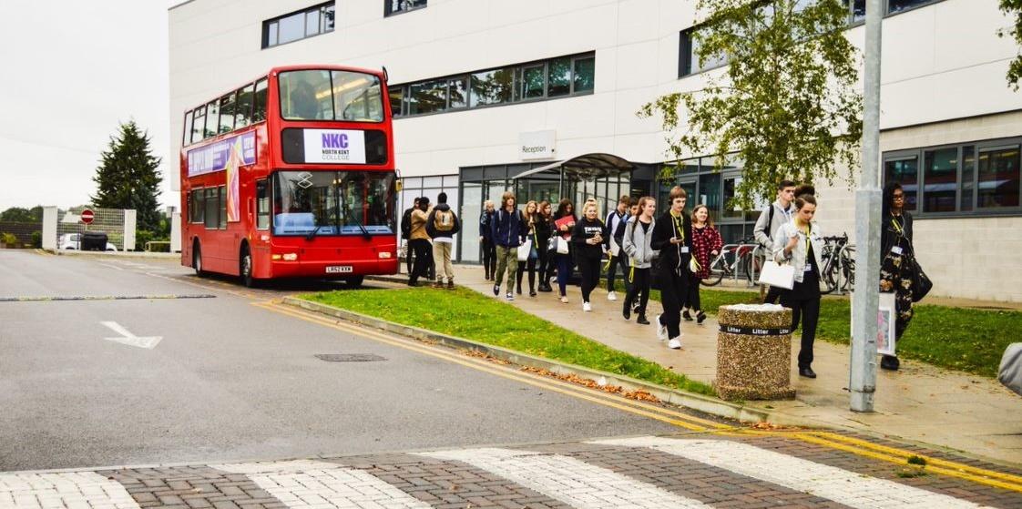 Students getting off of a bus