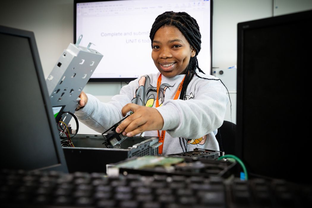 female_student_with_computer_parts