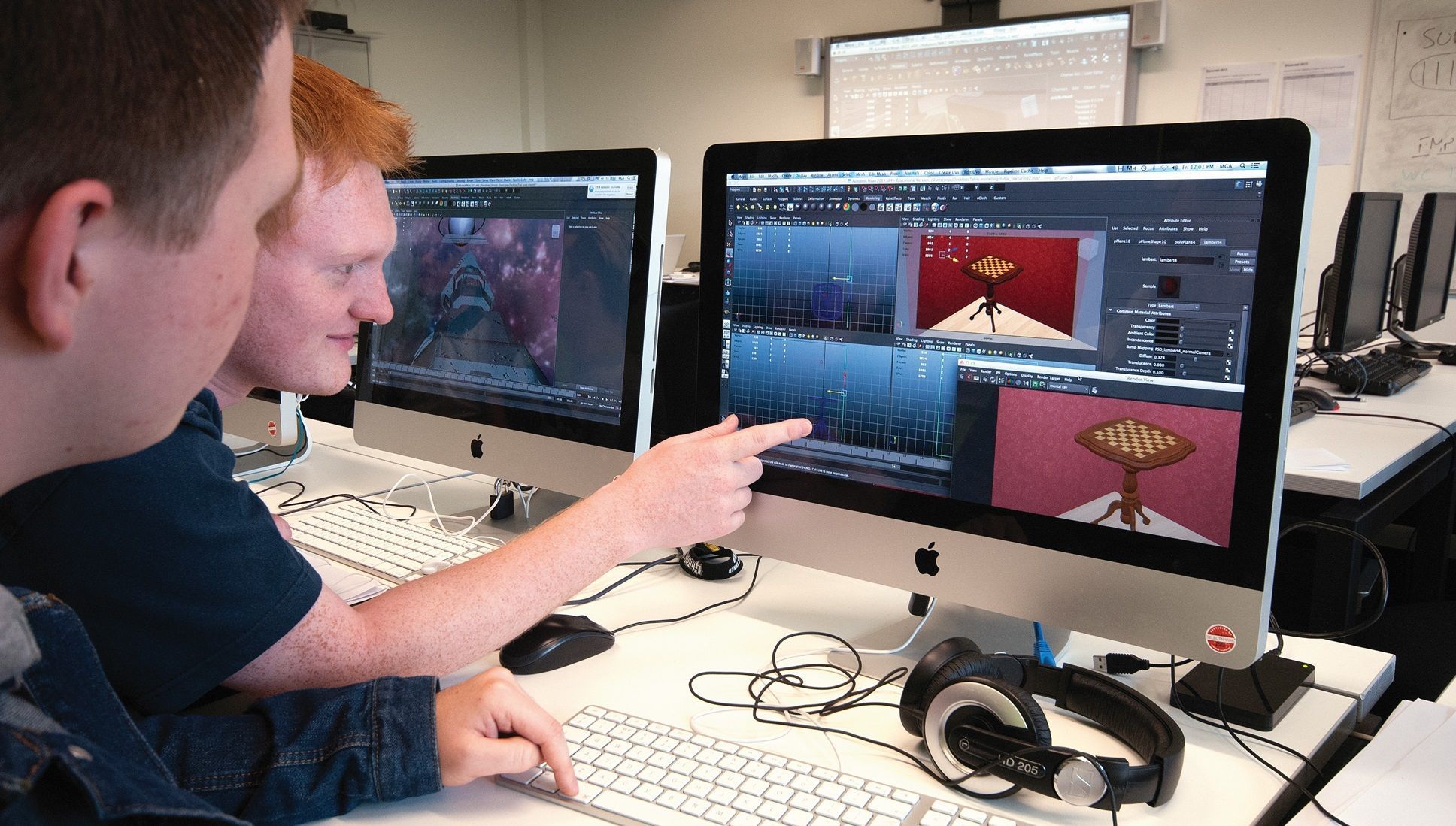 Two students looking at computer screen