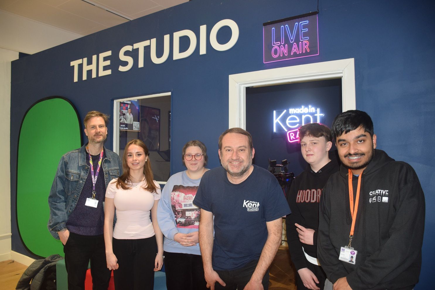 Students and lecturers outside radio studio