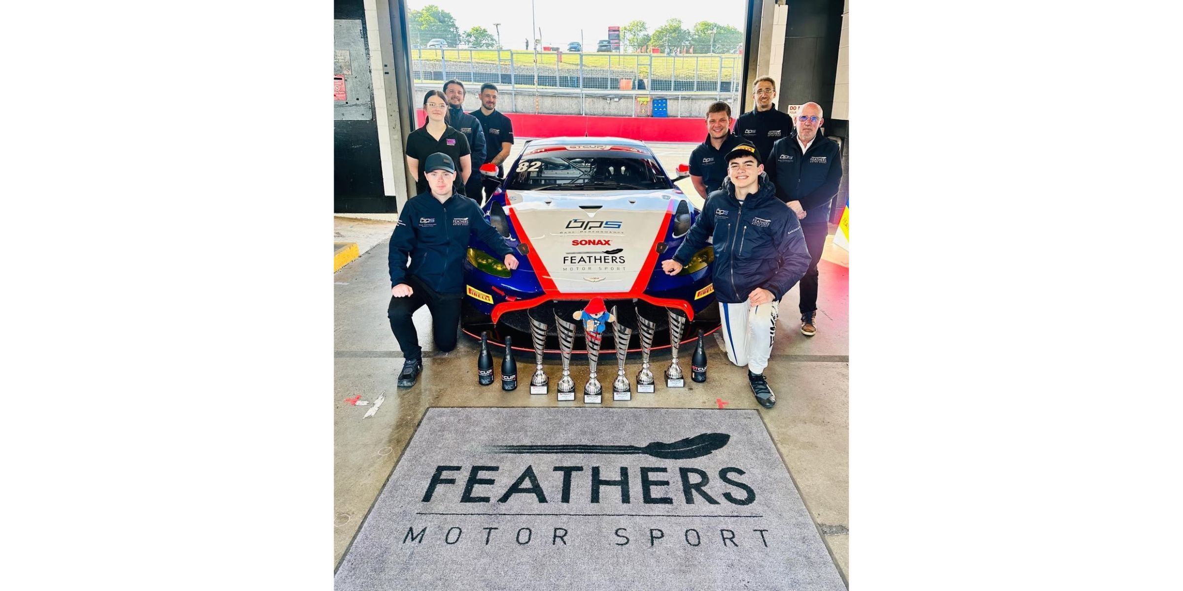 Students around motor car
