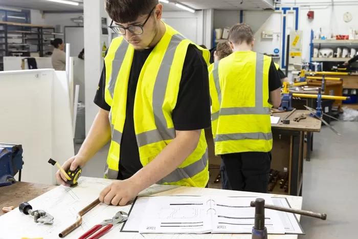 Student in Plumbing Workshop