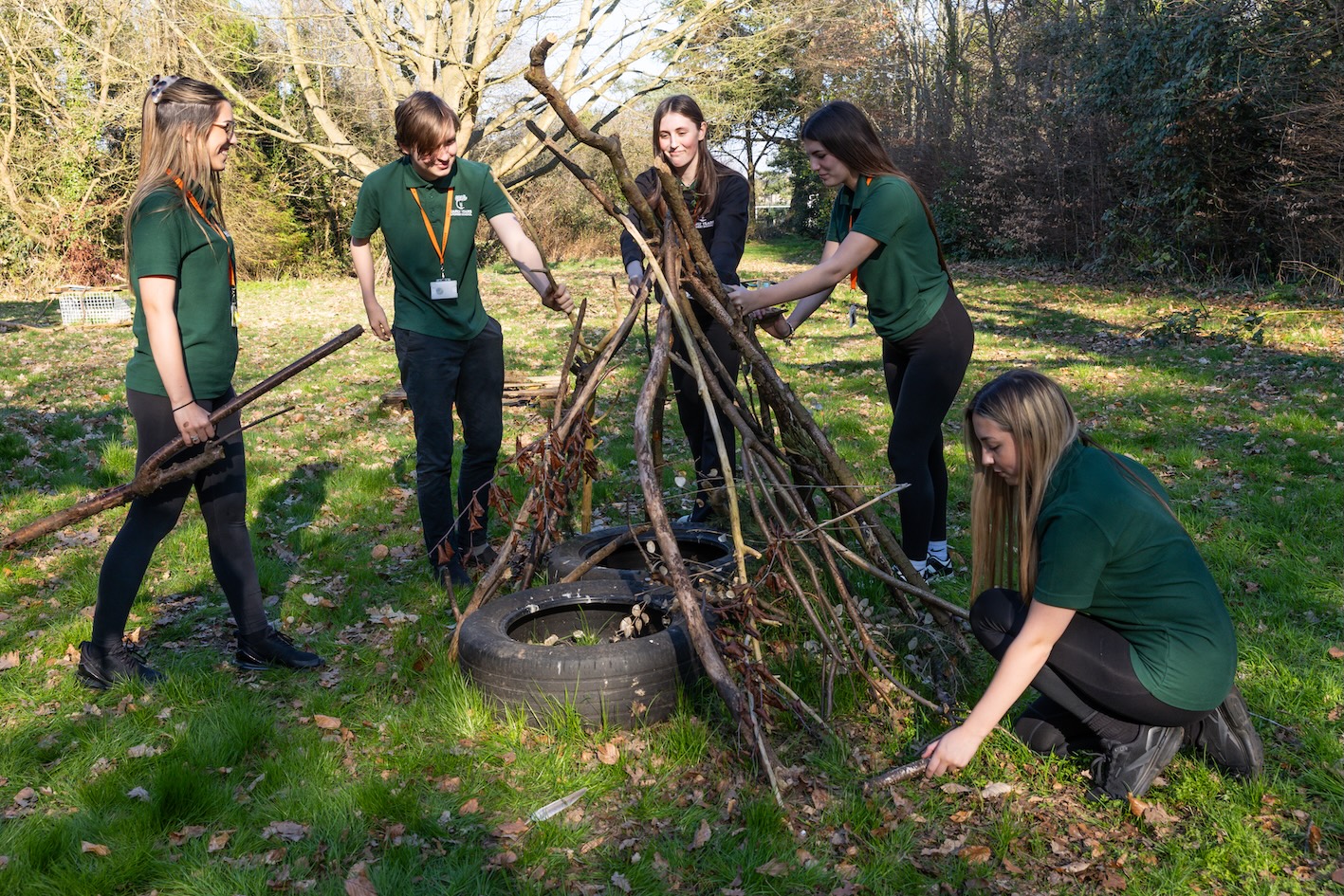 Students build forest school den