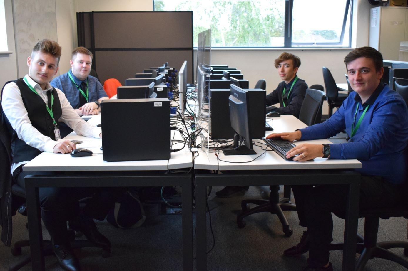 North Kent College Computing students sitting at their computer screen