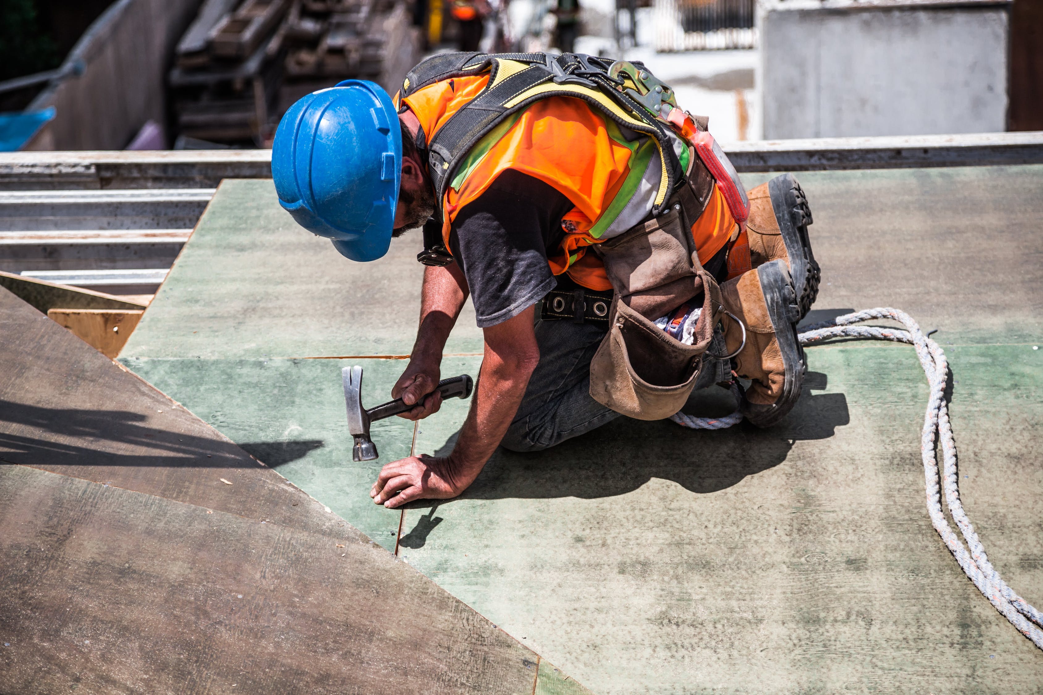 NKC Construction Man Using Hammer