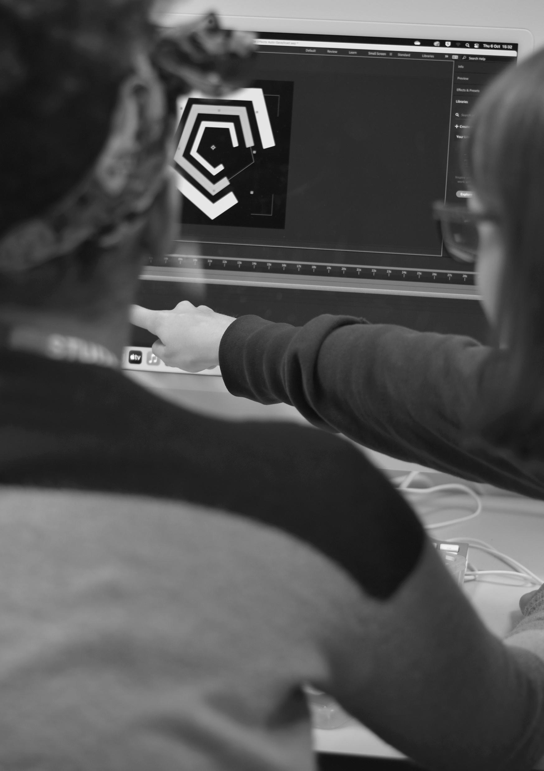 NKC_Graphics_Student_Pointing_At_Monitor