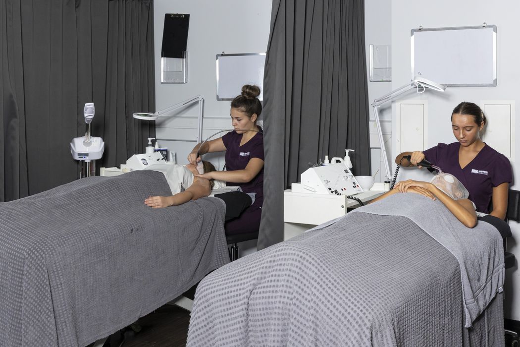 two girls giving a facial