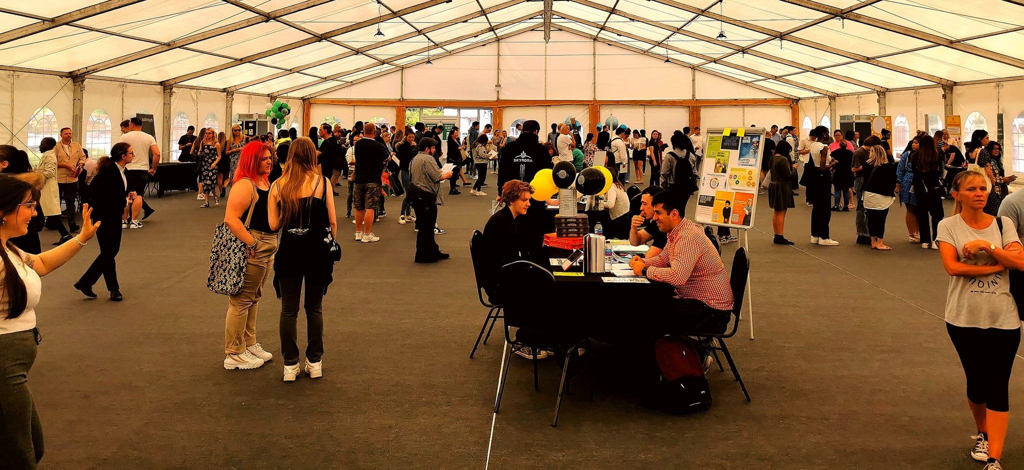 Job seekers inside the event marquee cropped