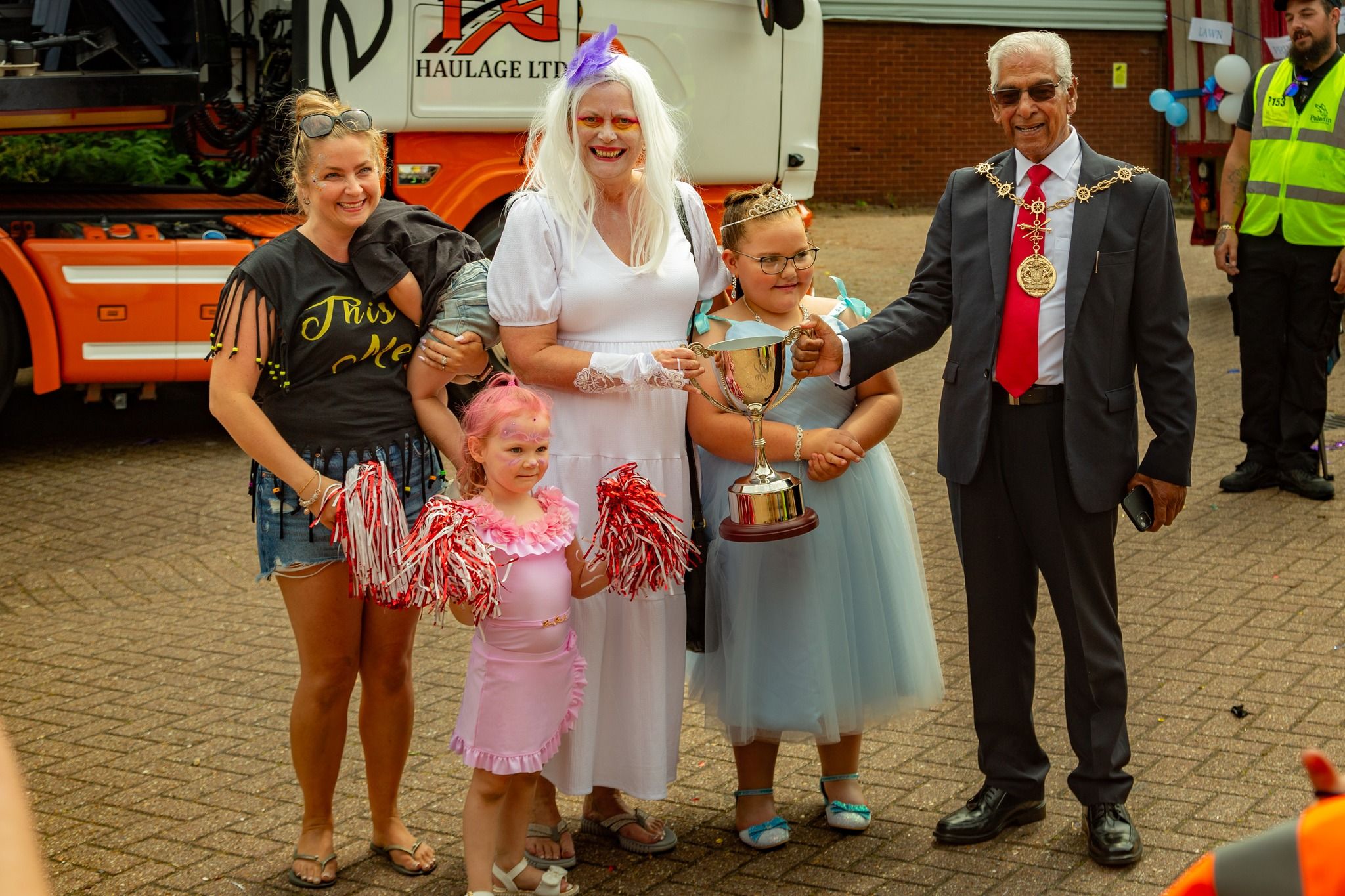 Nursery Practitioners Sarah Crowley and Lois Hutton collect their trophy from the Mayor of Gravesend Cllr Gurdip Ram Bungarjpg