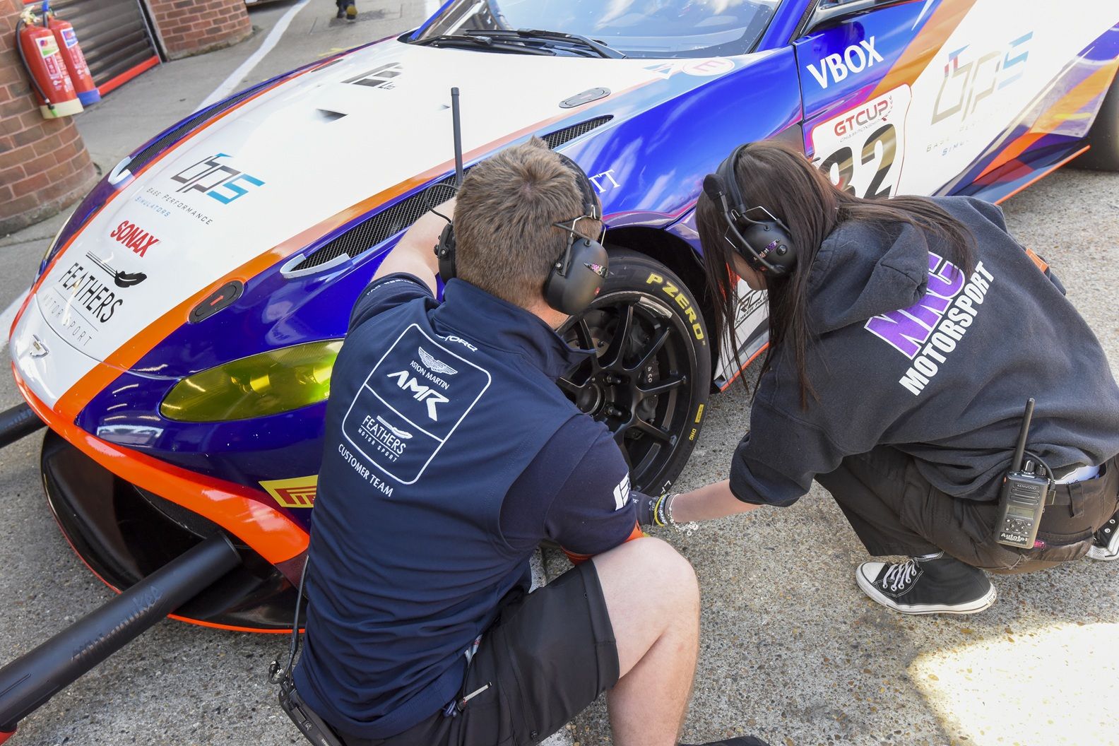 Students working on car