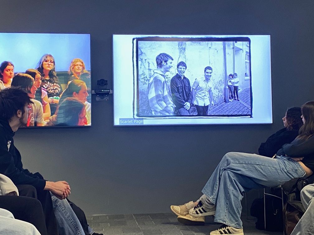 Students looking at TV screen
